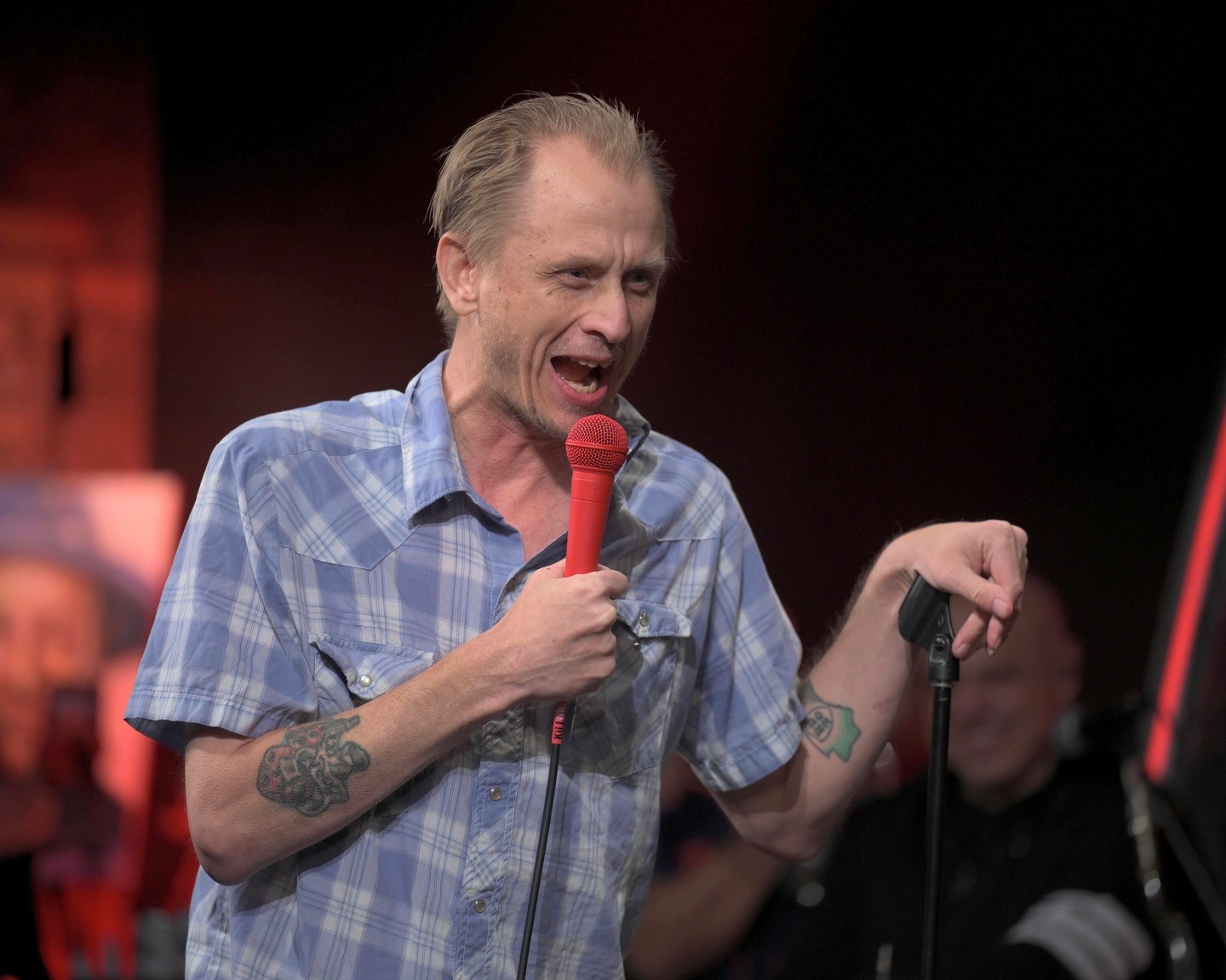 Davey Wester performing stand up comedy on stage