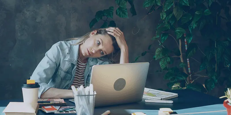 A woman struggling to deal with imposter syndrome