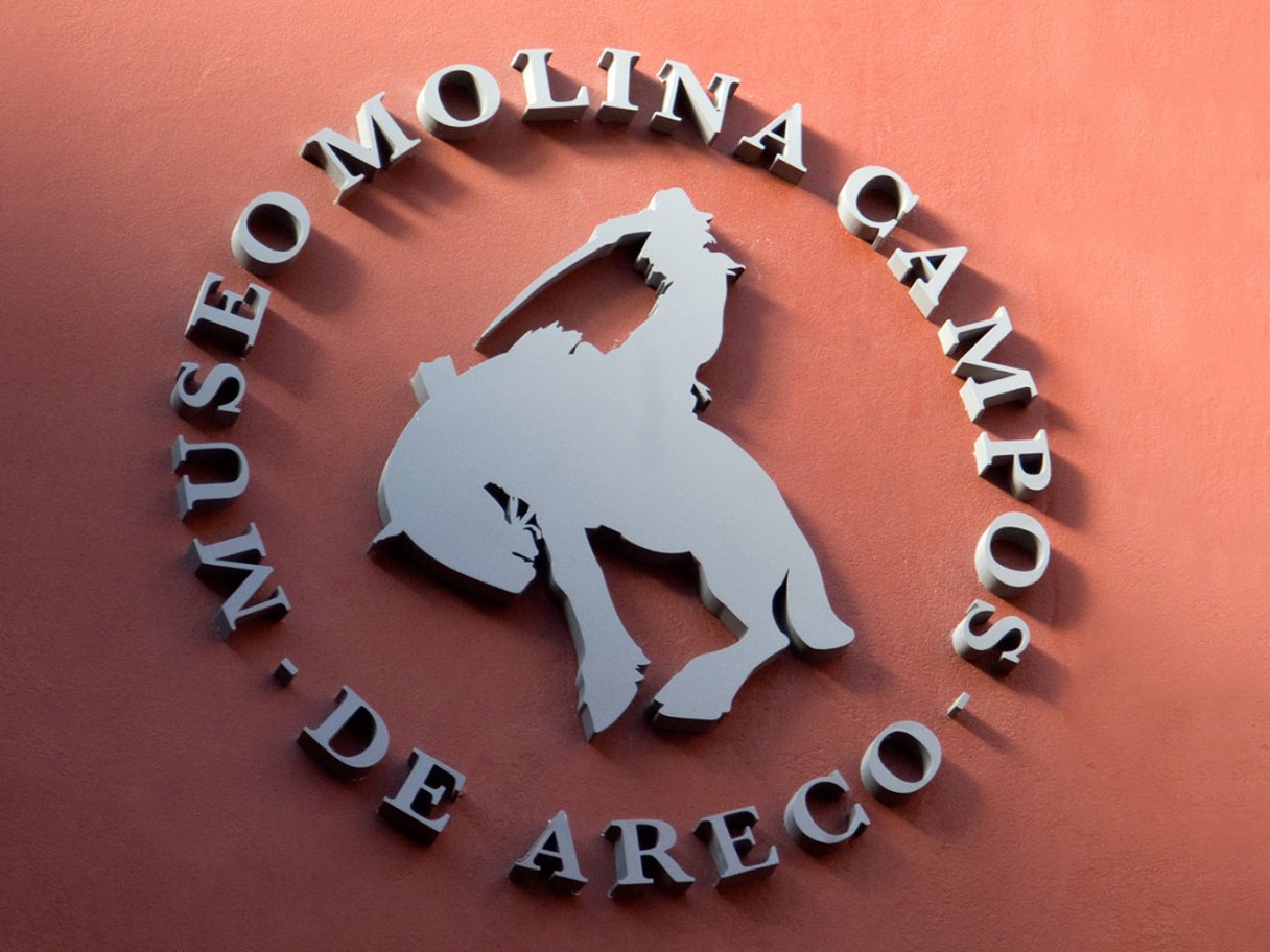 Rustic cabin in a golden field at sunset