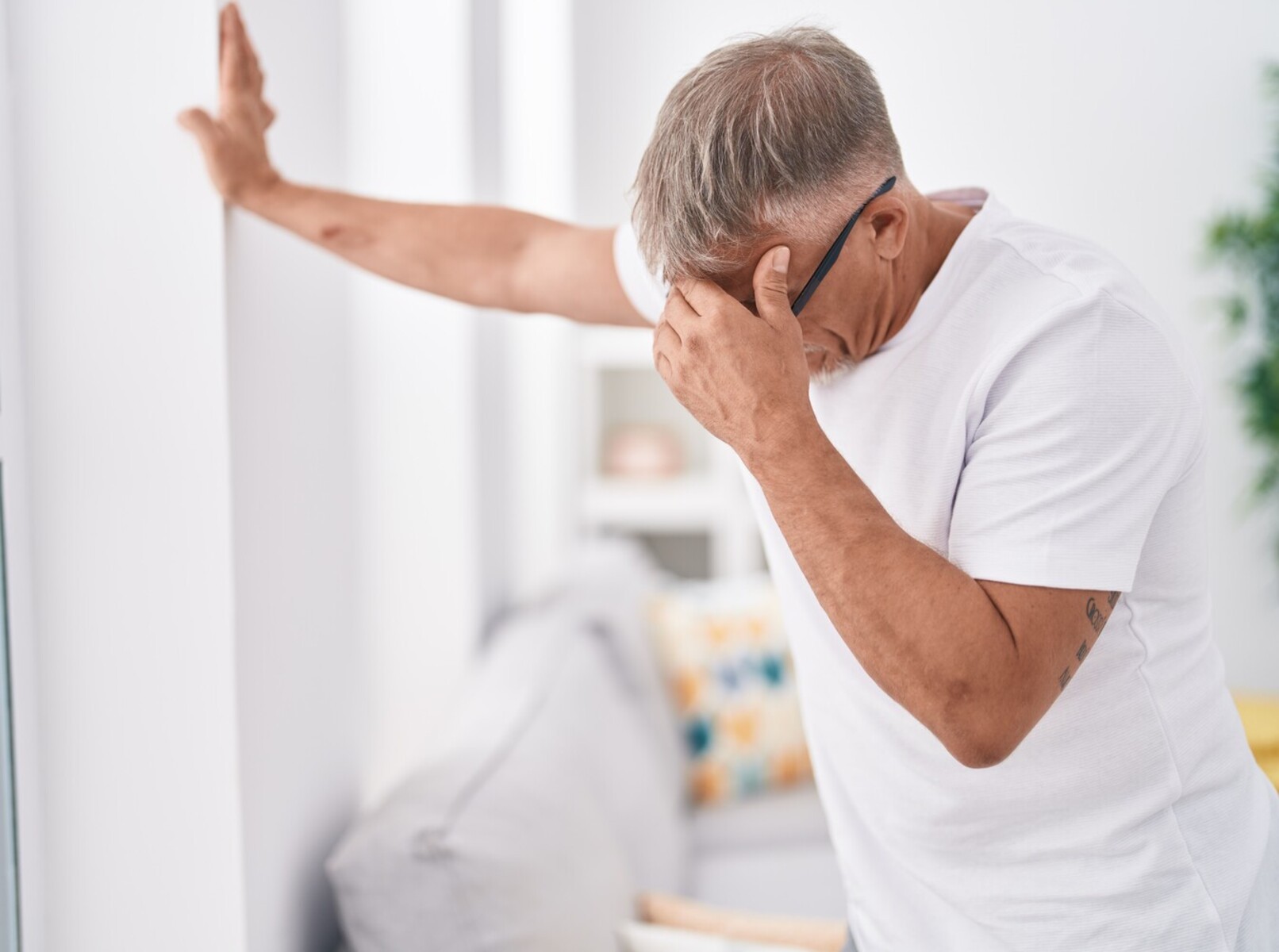 older man feeling dizzy after spending too much time doing infrared sauna weight loss