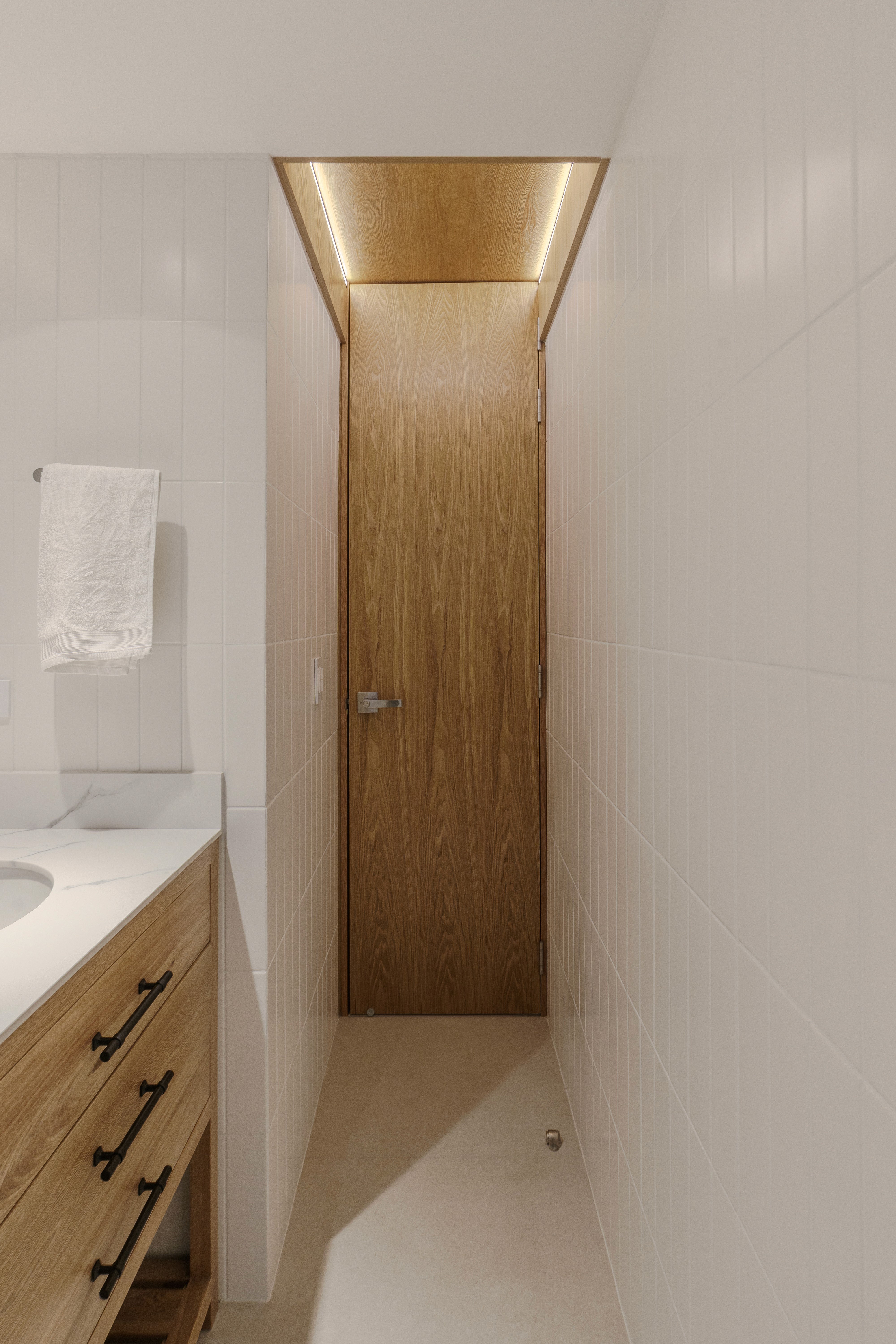 Double-height interior with flowing sculptural forms and warm raking light