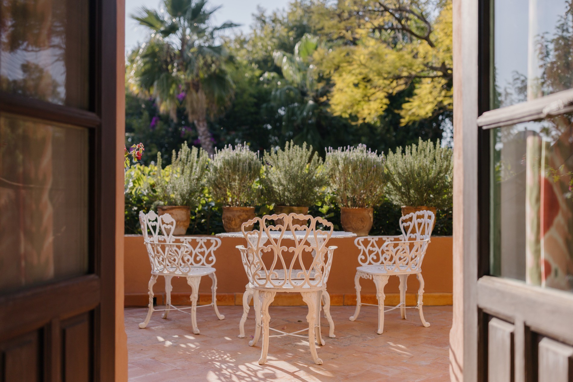 La Residencia San Miguel multi-level terraces with bougainvillea, rooftop gardens, and hillside views