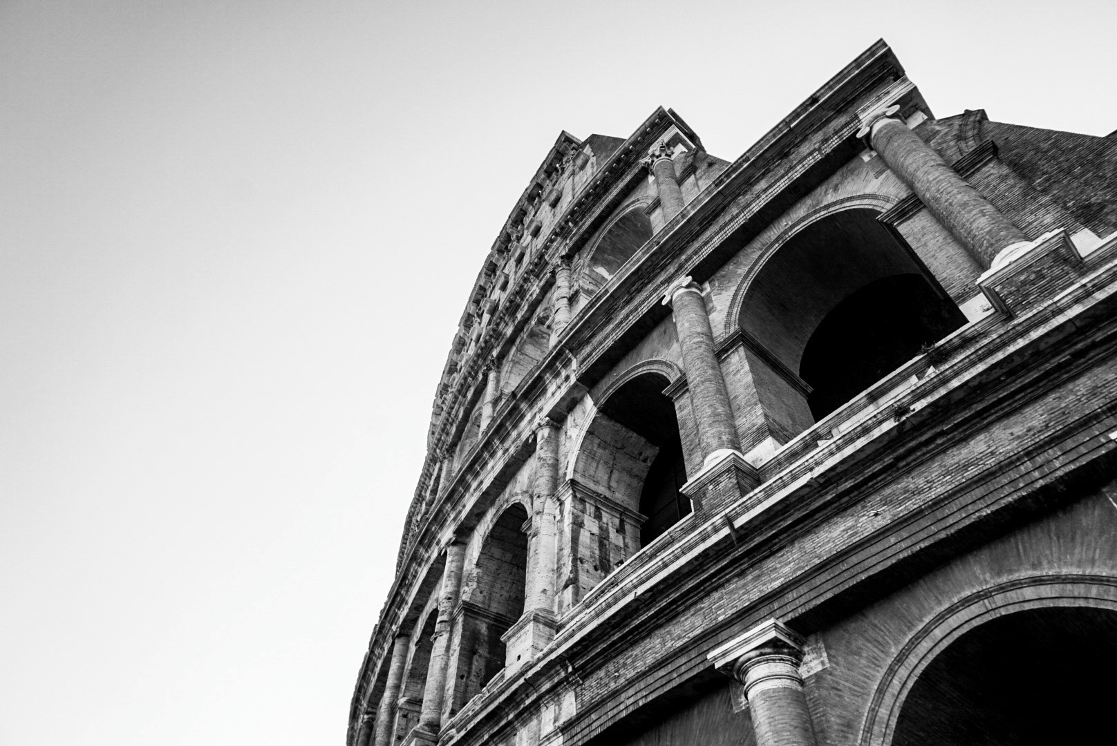 A black and white photo of the Colosseum in Rome, photographed by Janice Chen.