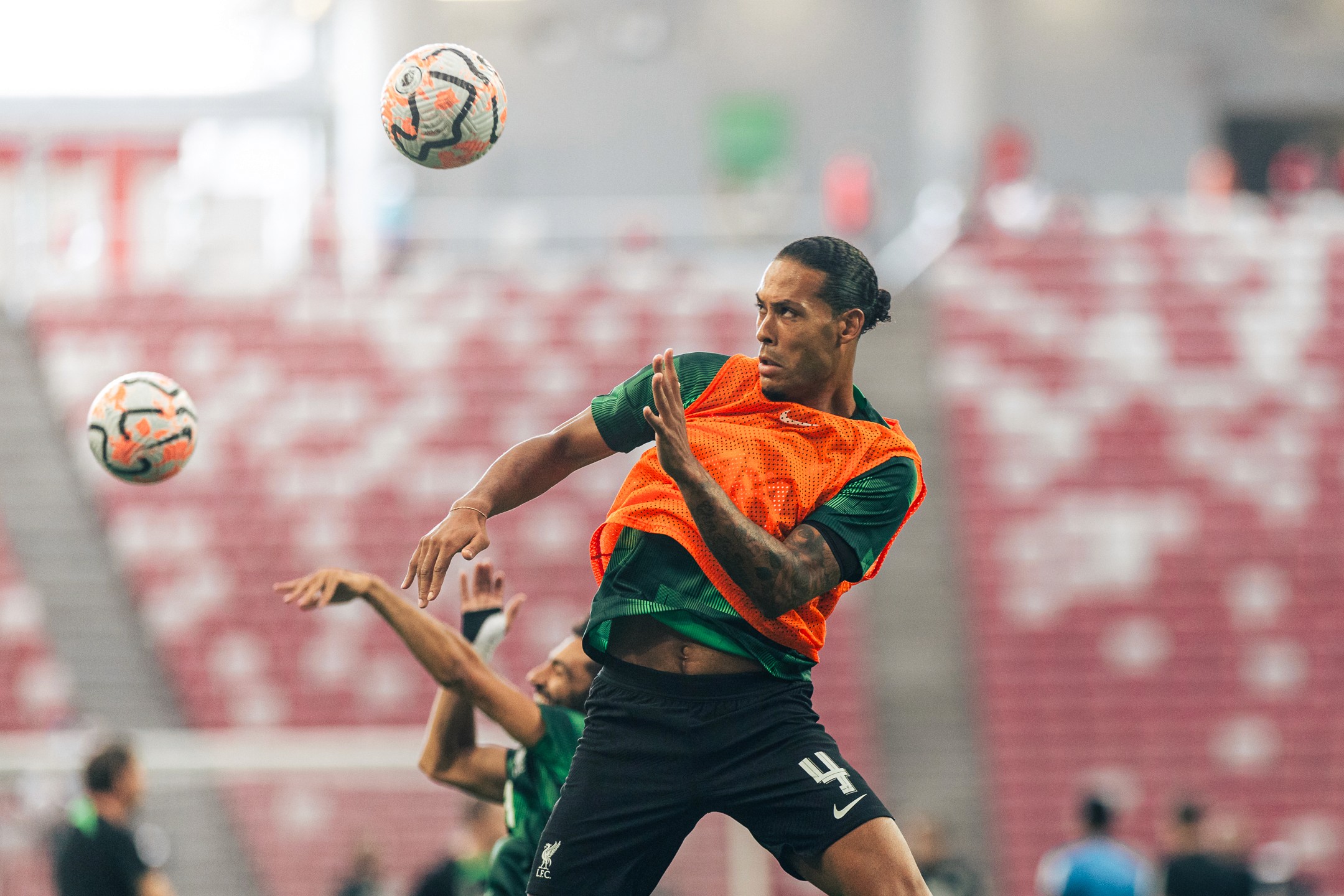 Caption of Liverpool, Virgil Van Dijk heading the ball, Singapore Festival of Football 2023