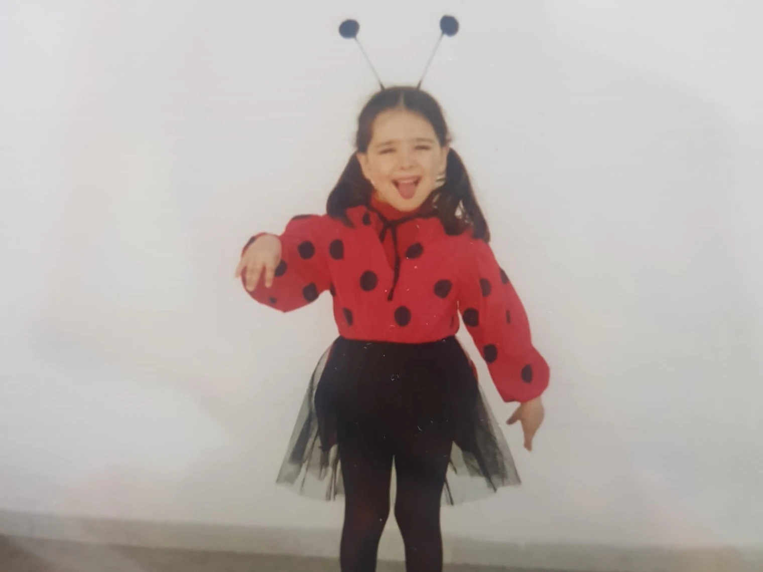 Young Lorena smiling at the camera