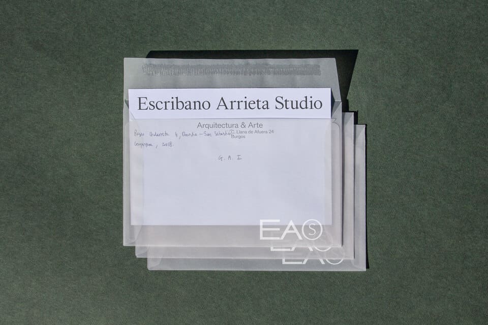 Photo of envelopes with a transparent material and cards with a unique  text layout design.