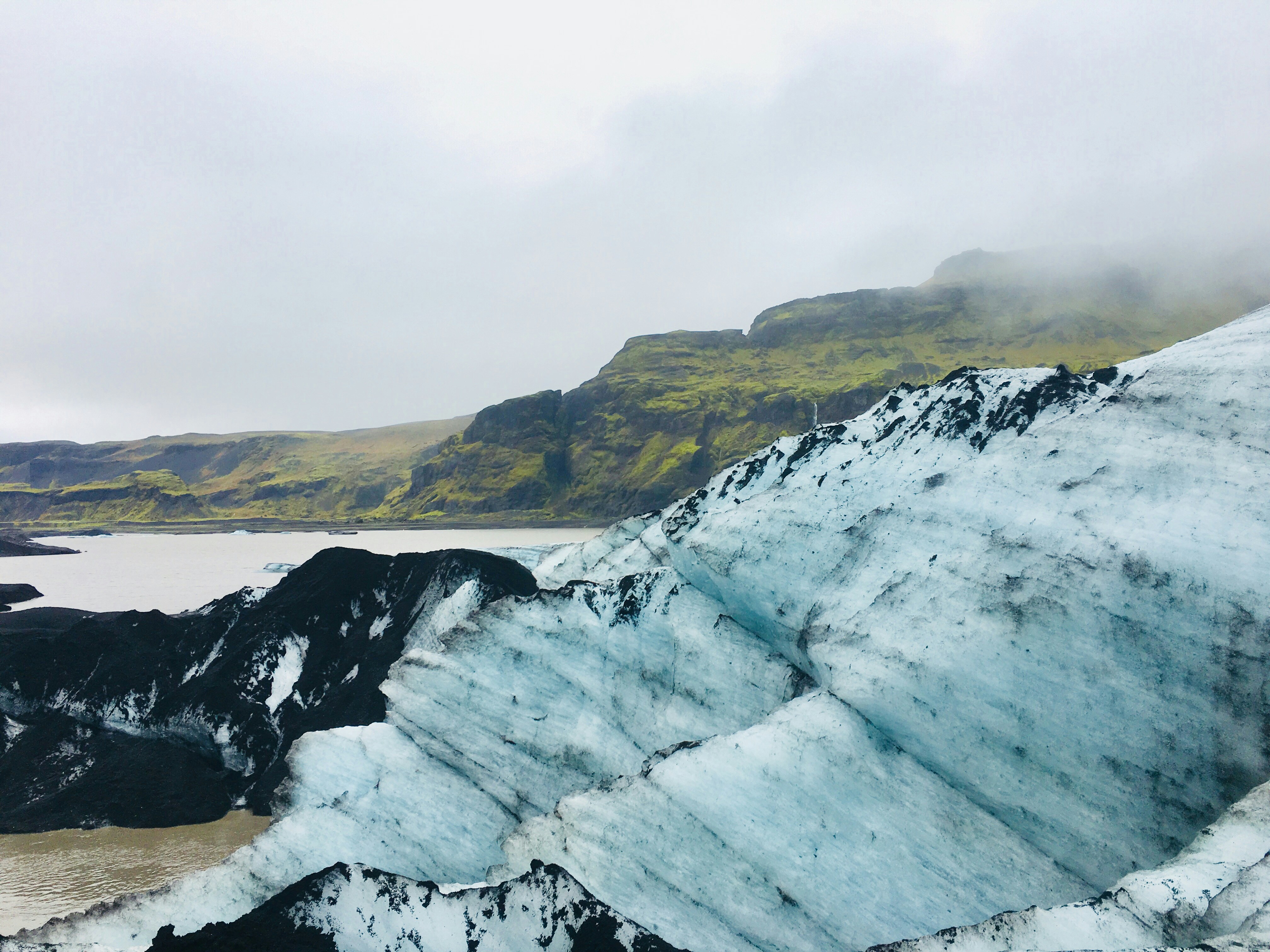 Sólheimajökull glacier surrounded by volcanic terrain in South Iceland.
