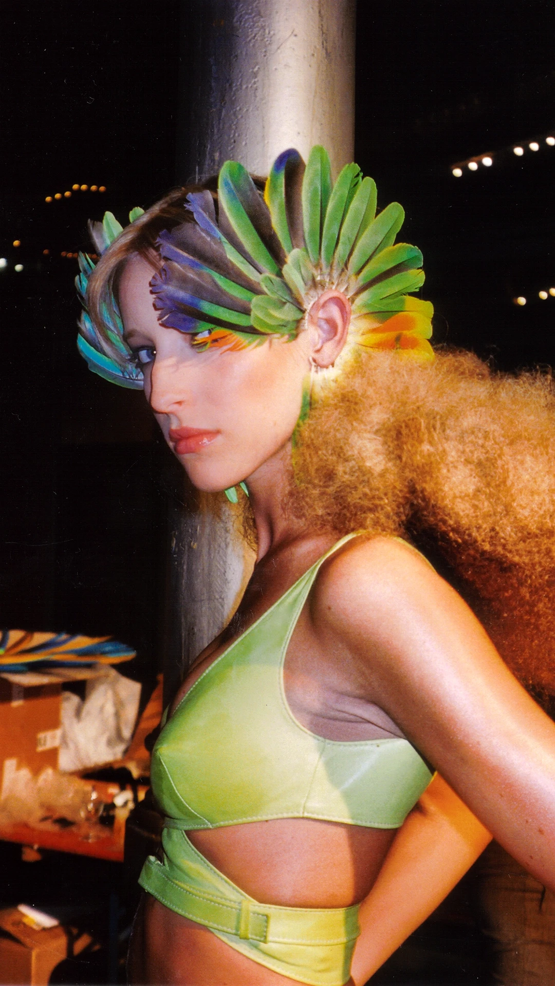 Large Macaw Feather Fan earrings in silver, accented with vibrant orange, yellow, and blue feathers, from the archival runway collection of Shaun Leane.