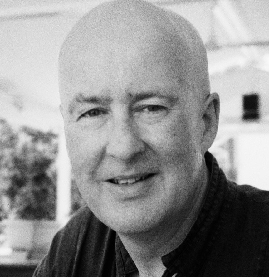 person sitting in a chair in front of a man