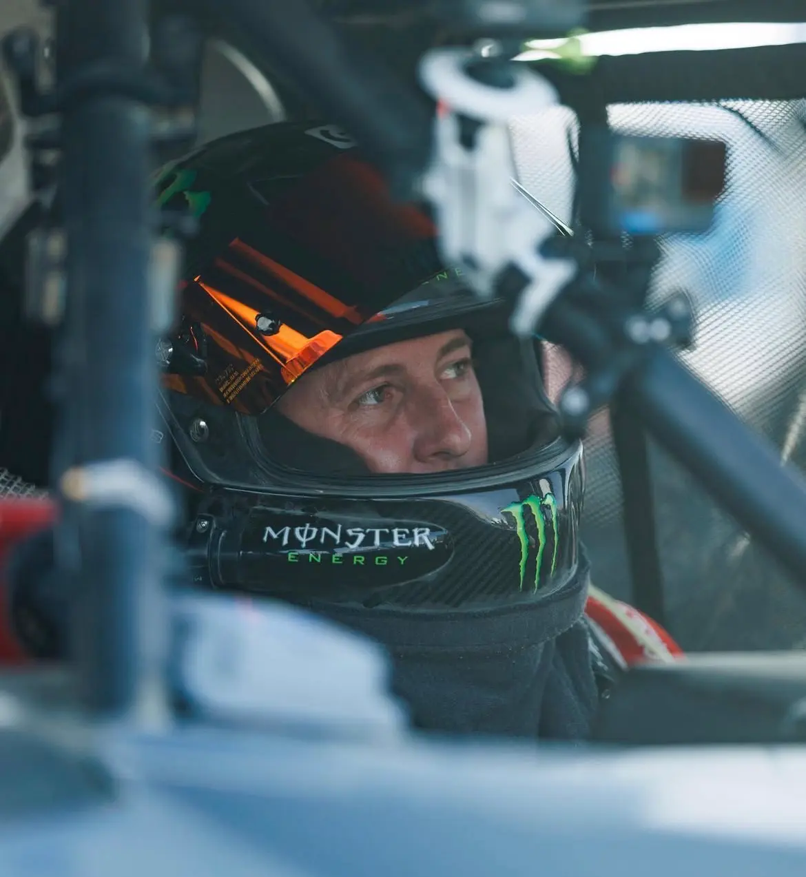 motorsport driver Casey Currie Monster Energy race helmet in a car