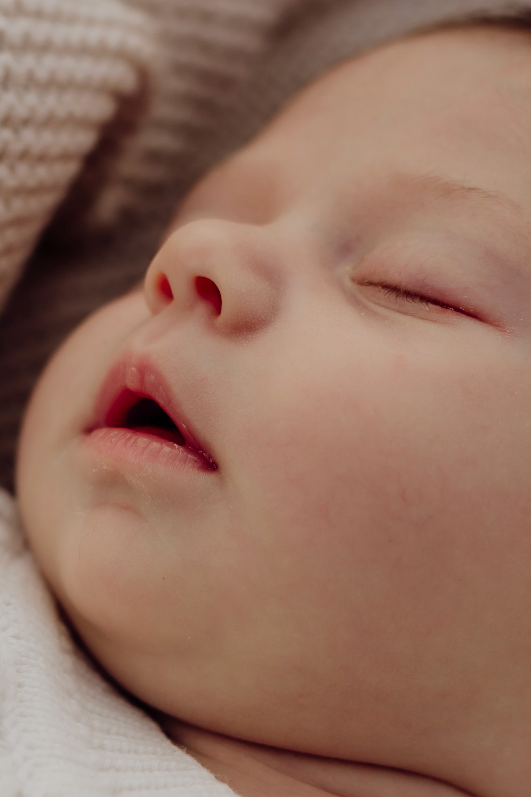 Close up of newborn baby's face while sleeping