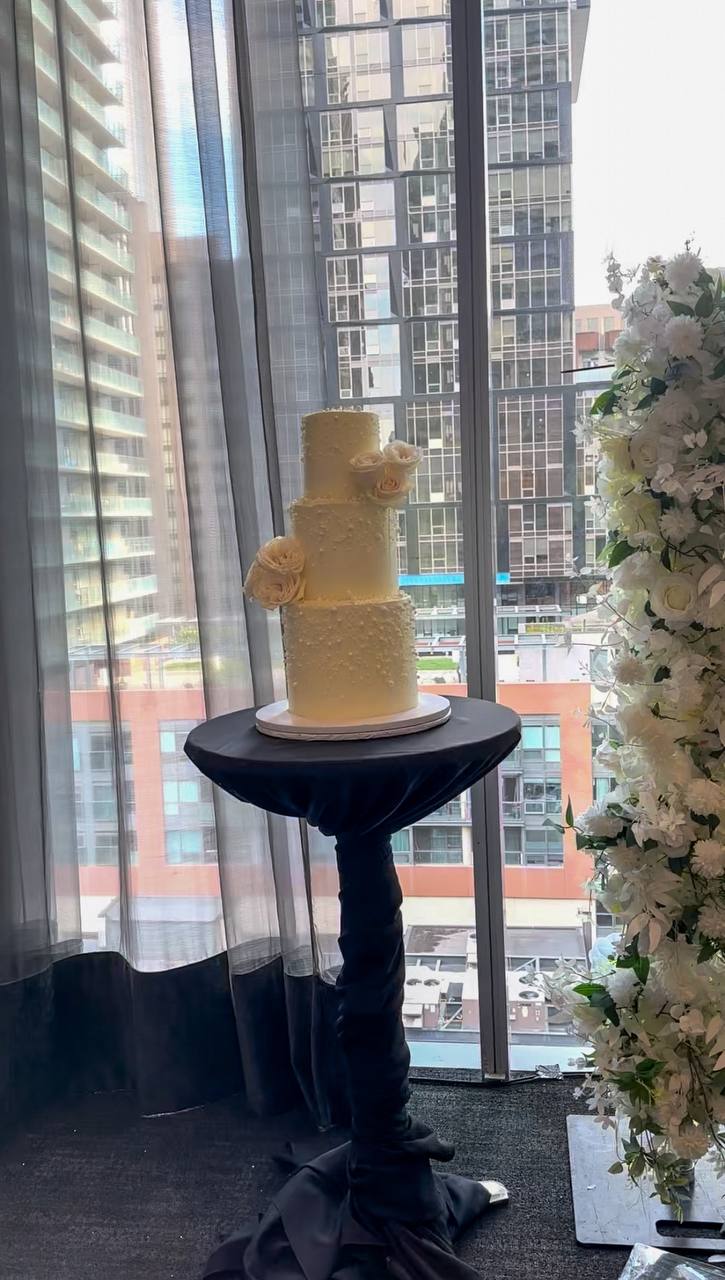 3 tier wedding cake on a display 