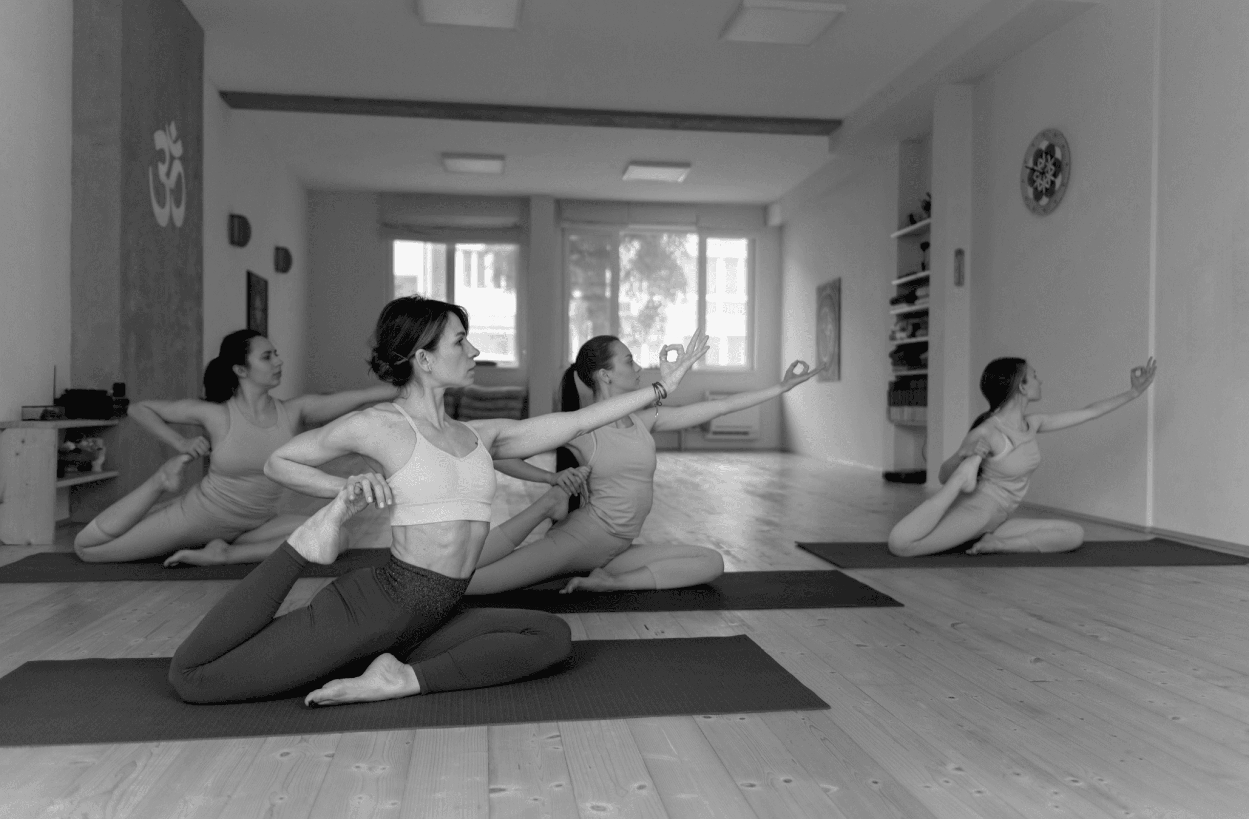Fit women stretching during yoga session