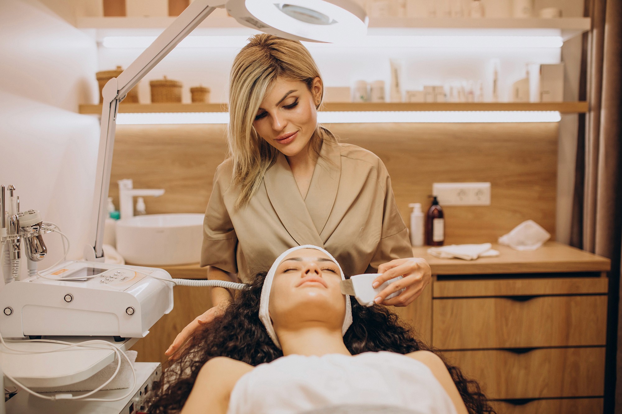 Cosmetologist performing a facial treatment on a client in a spa clinic