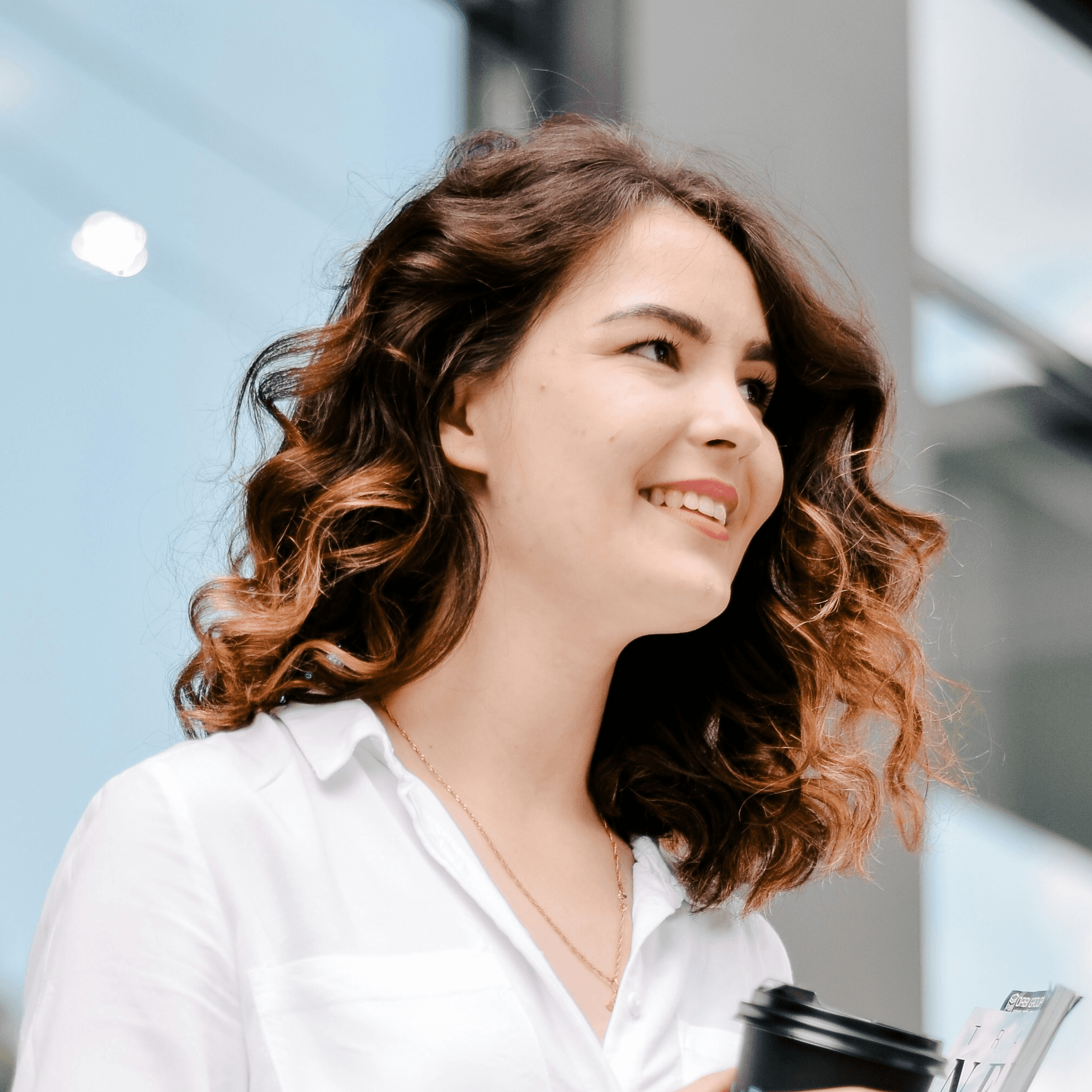 woman holding tumbler