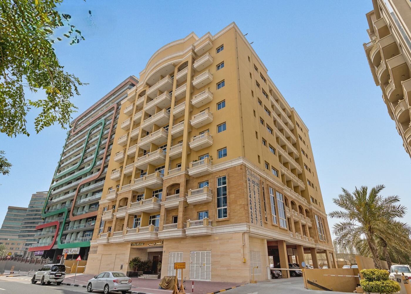 Corner view of a modern apartment complex. Professional real estate advice.