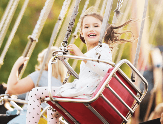 Happy smiling girl on a fairground ride | Egland Park | Ashbourne, Co Meath