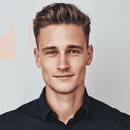 Headshot of a smiling young man with styled brown hair.