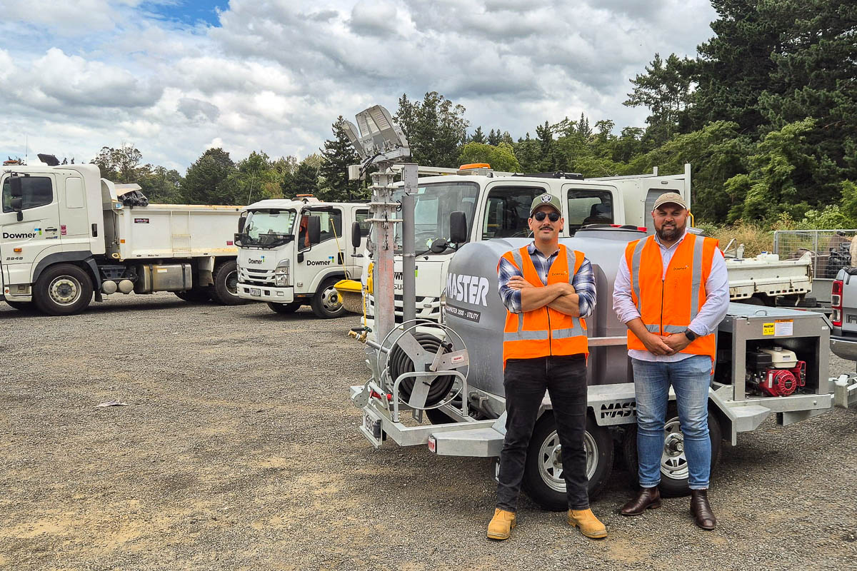 Downer crew in hi-vis standing with their AquaMaster 2000 at the Waipā depot