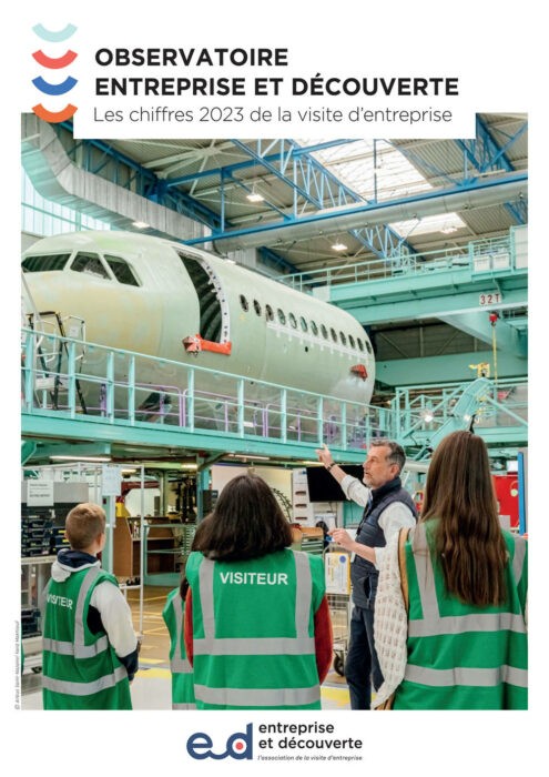 brown and white concrete house near green trees during daytime