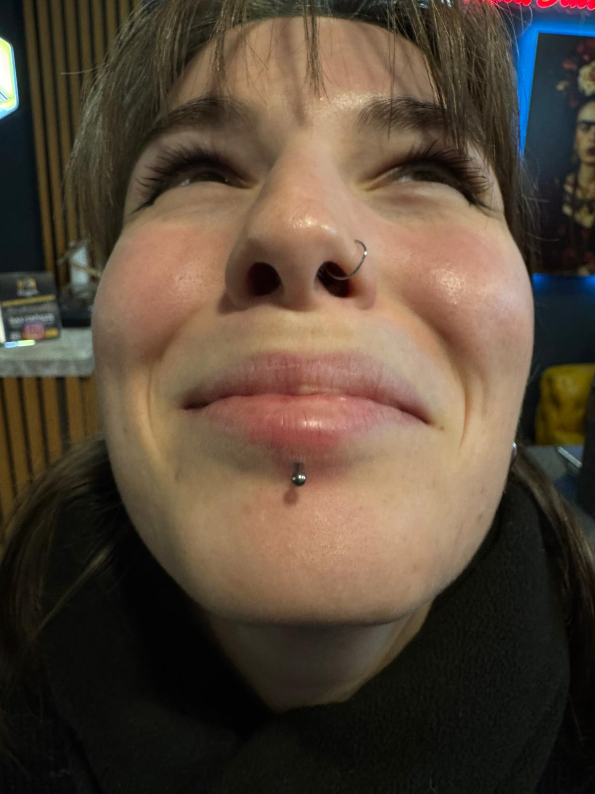 Labret piercing at Calavera ink berlin Tattoo Studio Reception Area Prenzlauer Berg