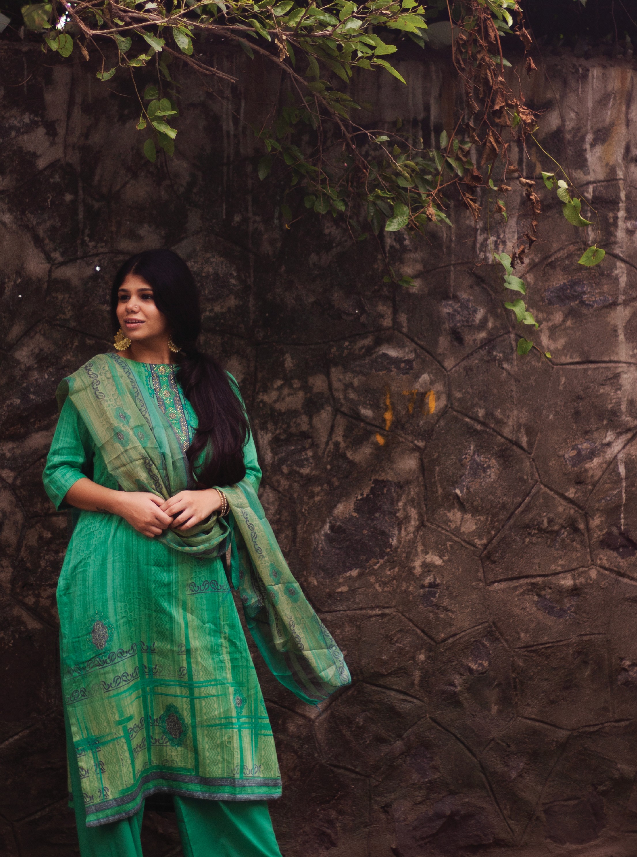 Stacked pink and red glass cosmetic jars on white—minimal skincare packaging display.