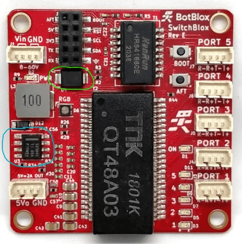 SwitchBlox Rev E board with the power source jumper and 5V regulator circuitry circled