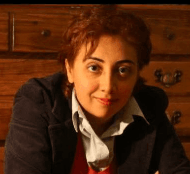 woman smiling wearing denim jacket