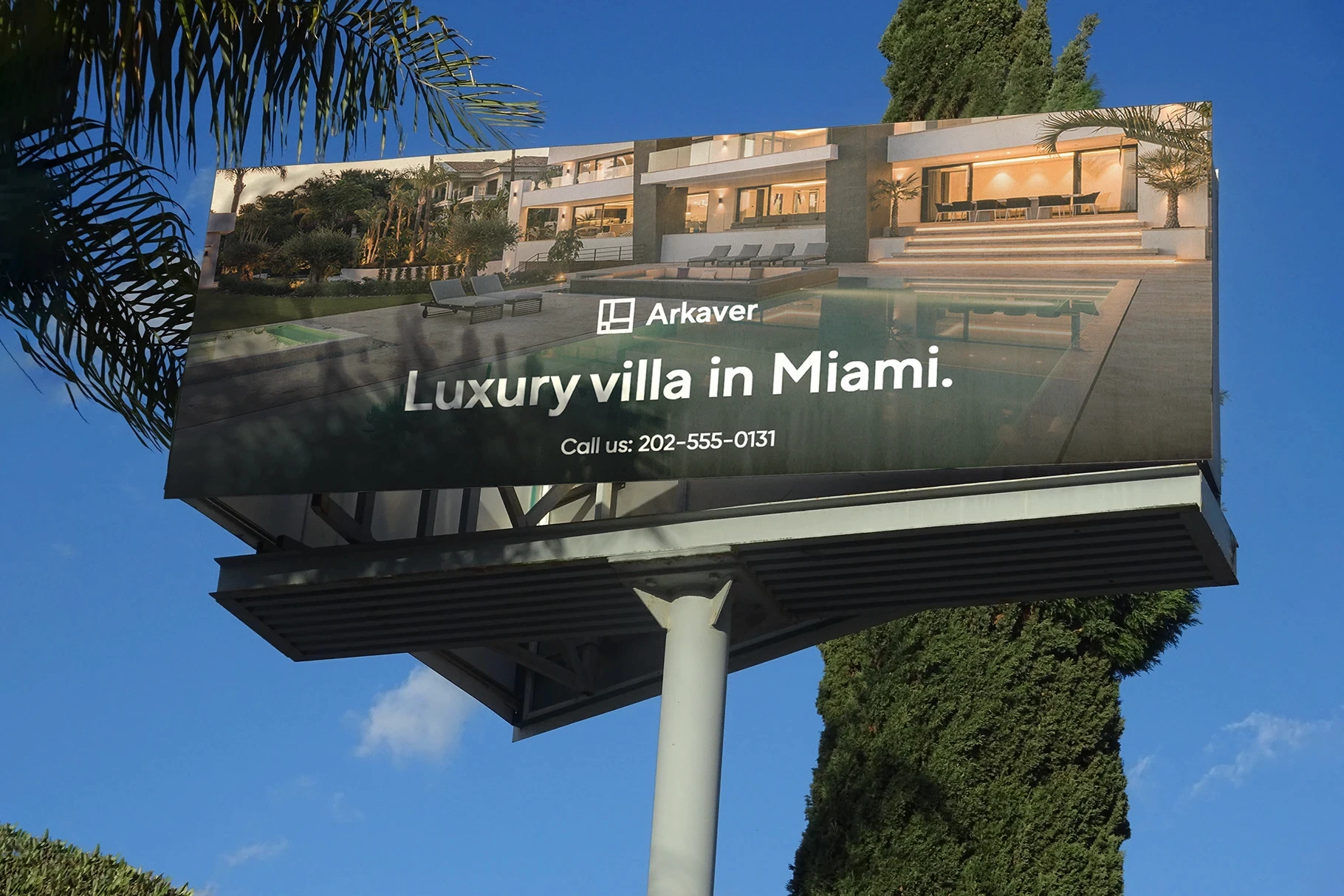 A roadside billboard mockup featuring an advertisement for a luxury villa.