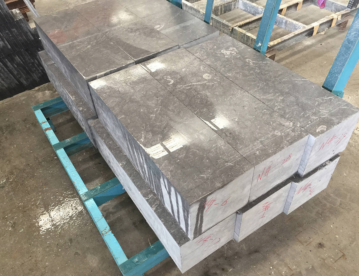 Dark gray marble slabs cut precisely by the Intelligent Laser Bridge Cutting Machine. The machine ensures high precision and stable cutting, perfect for creating uniform slab sizes with smooth finishes.