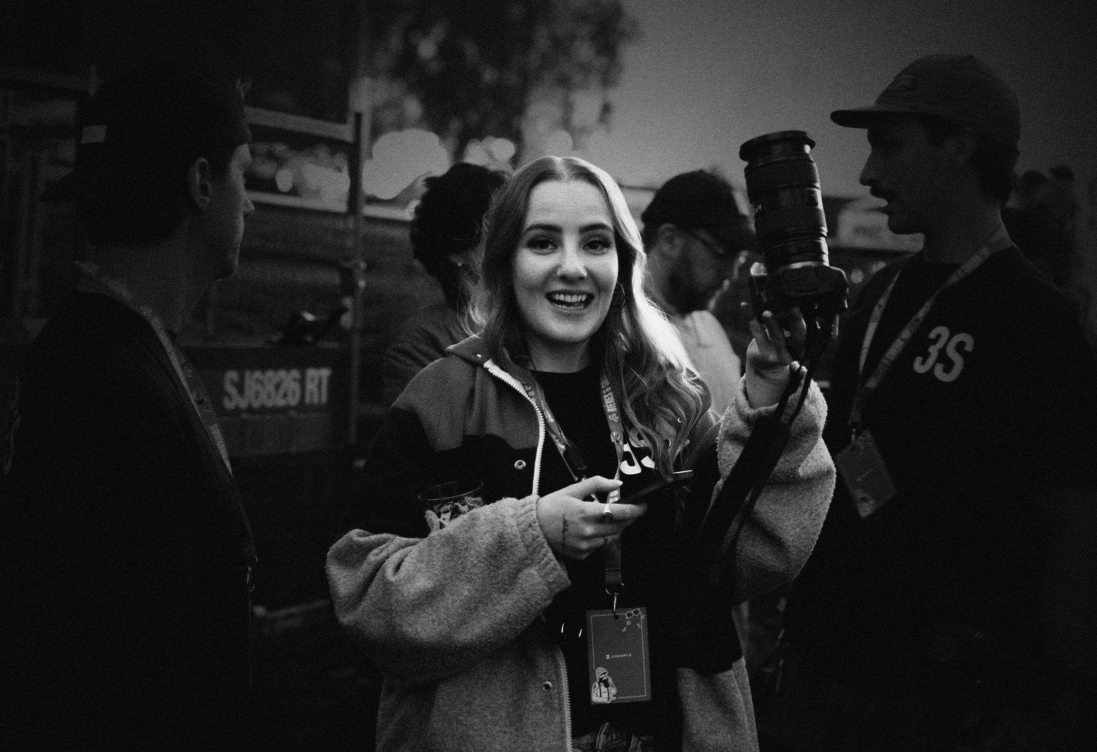 People celebrating, red stickers floating in the air