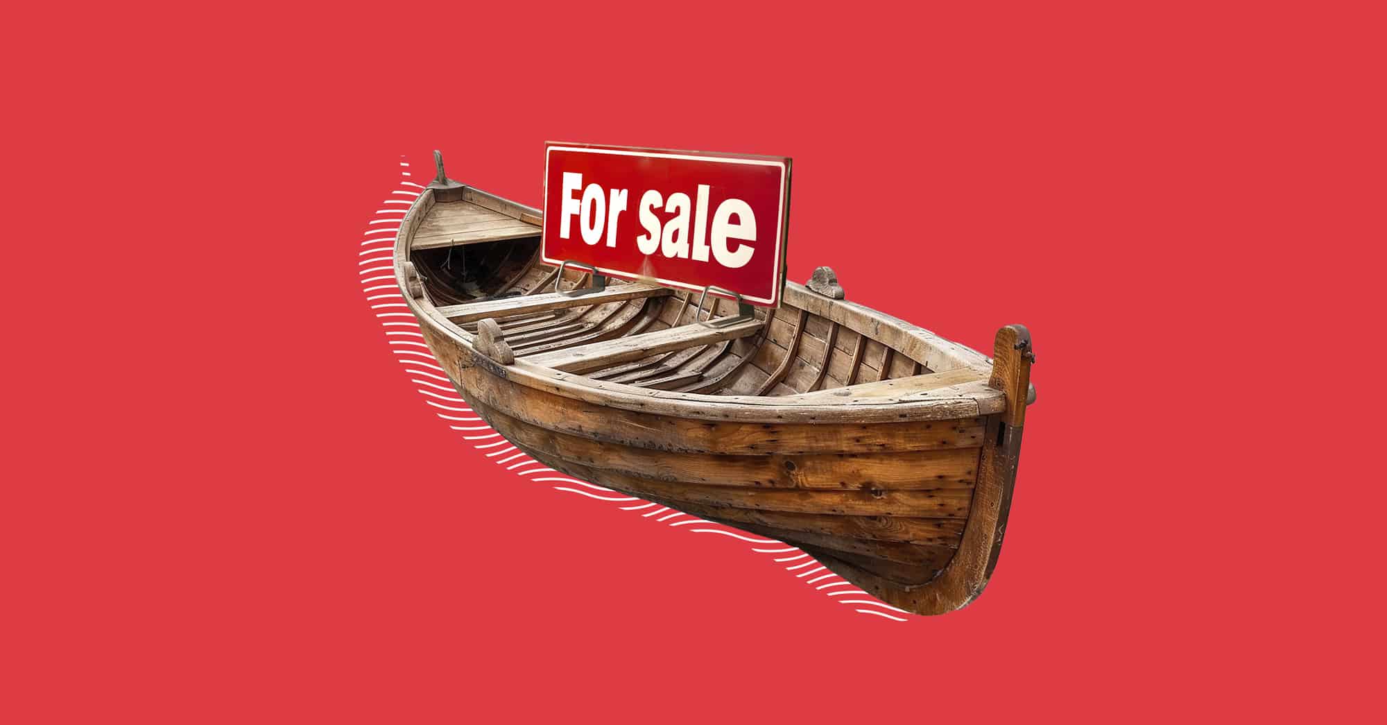 Bote de madera en venta con fondo rojo.