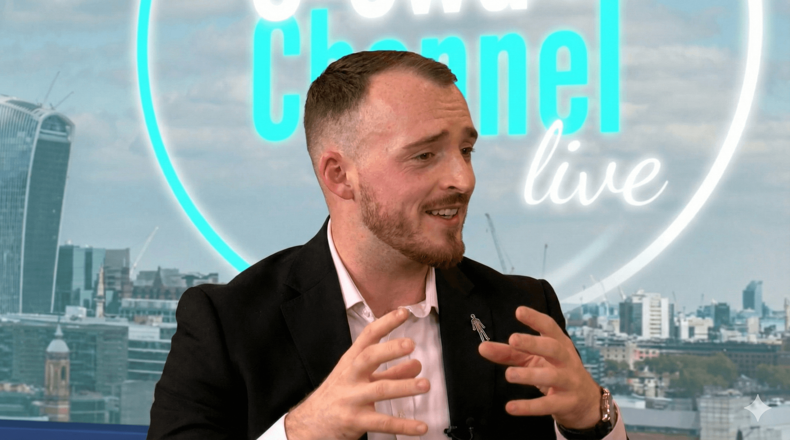 A large group photo of diverse team members gathered in an industrial-style space with arched ceiling.