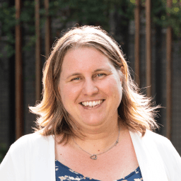 Possible member smiling and looking at the camera.