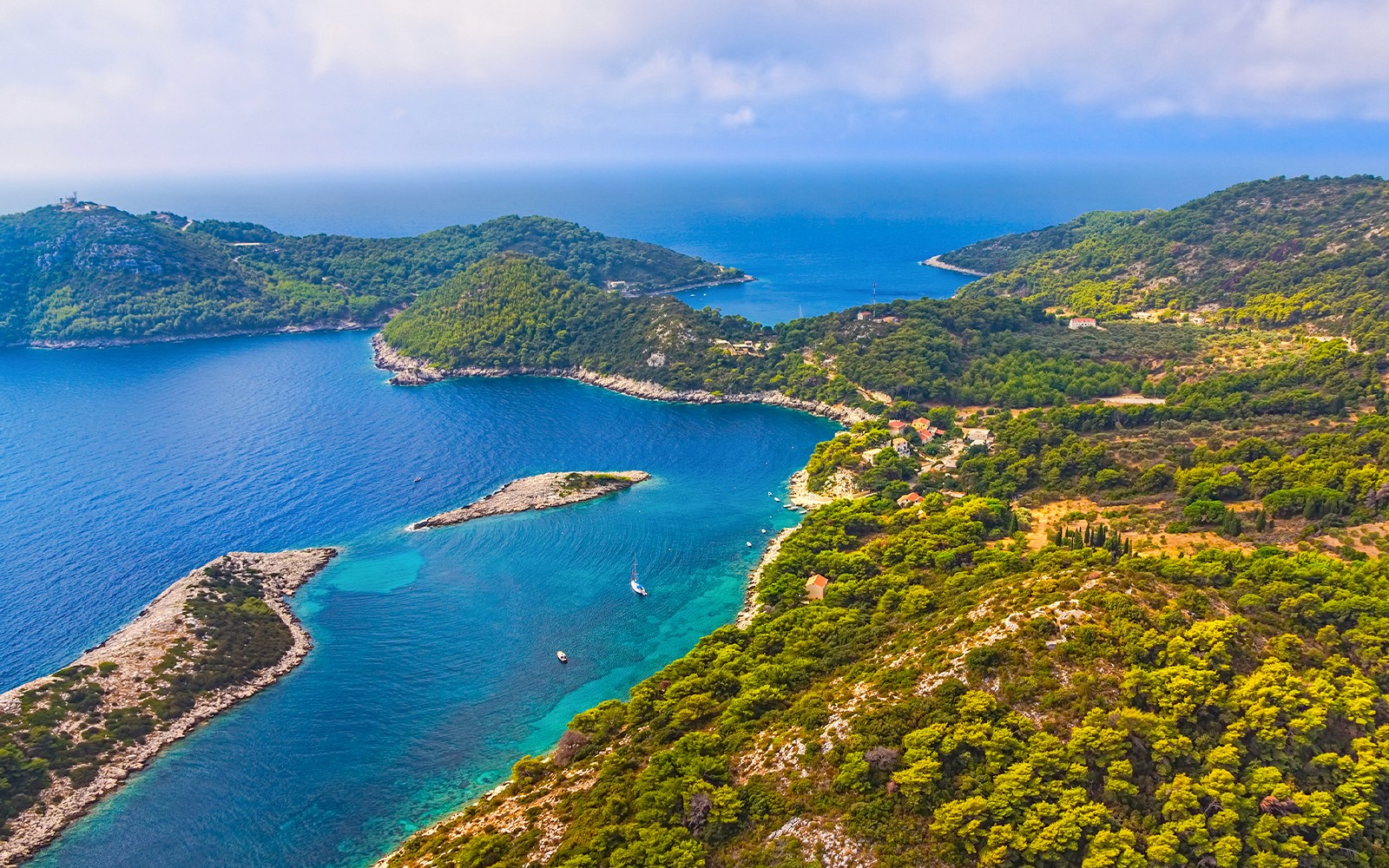 Aerial view of Elaphiti Archipelago's lush islands and turquoise waters near Dubrovnik.