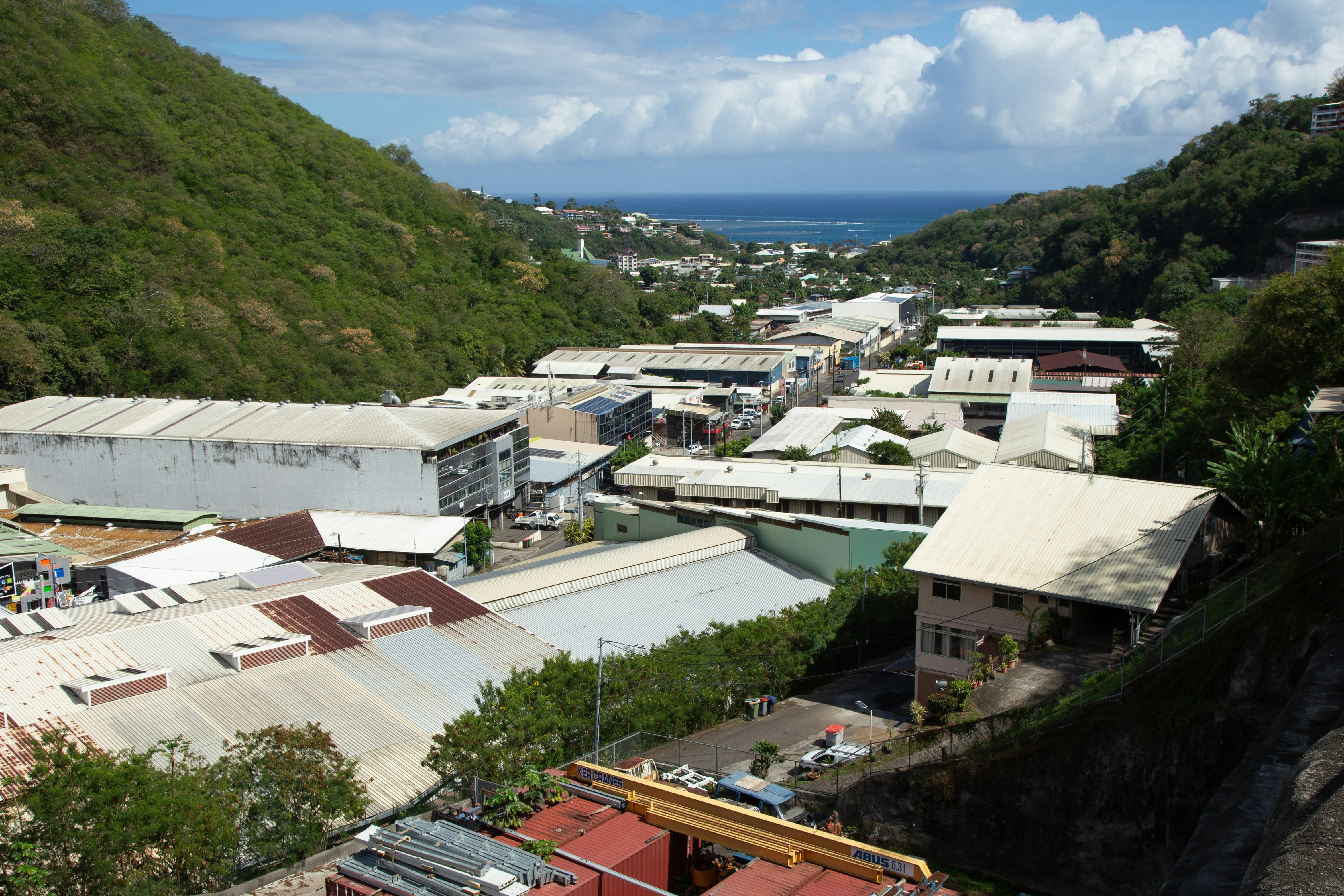 A view of a town with a mountain in the background
