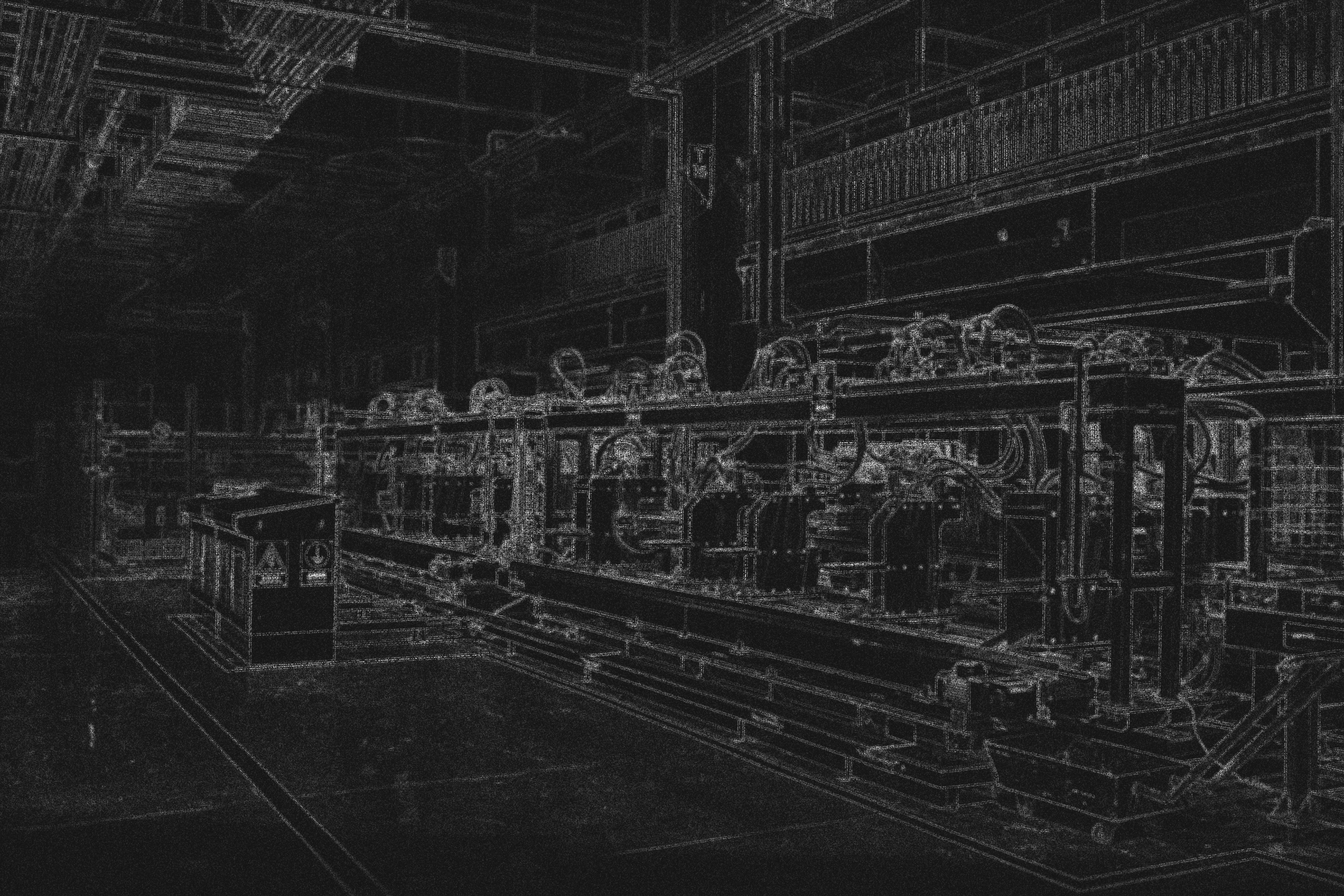 Stylized black and white image of industrial machinery