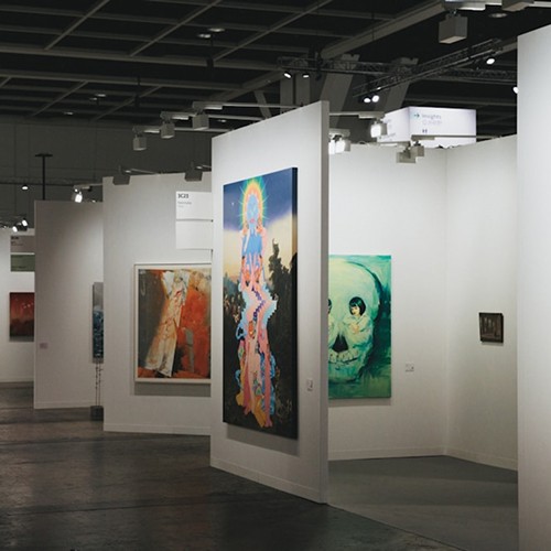 An art gallery showcases various paintings on display.