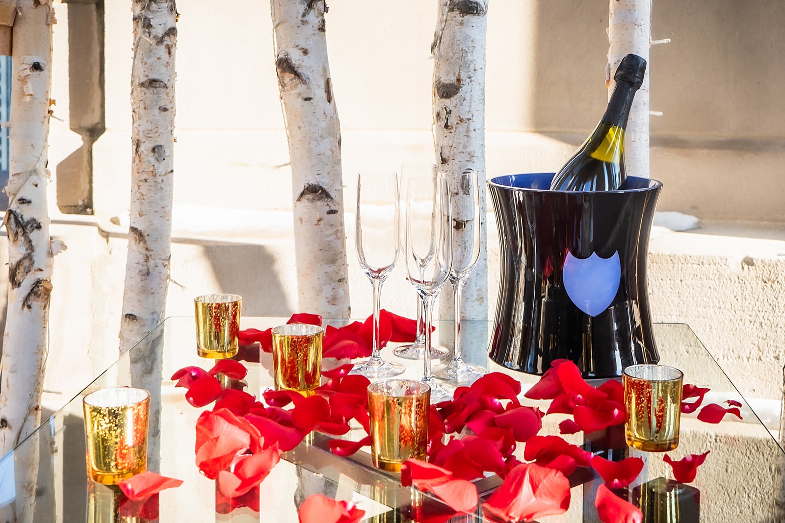 orange tinted wine glasses on rectangular brown wooden dining table