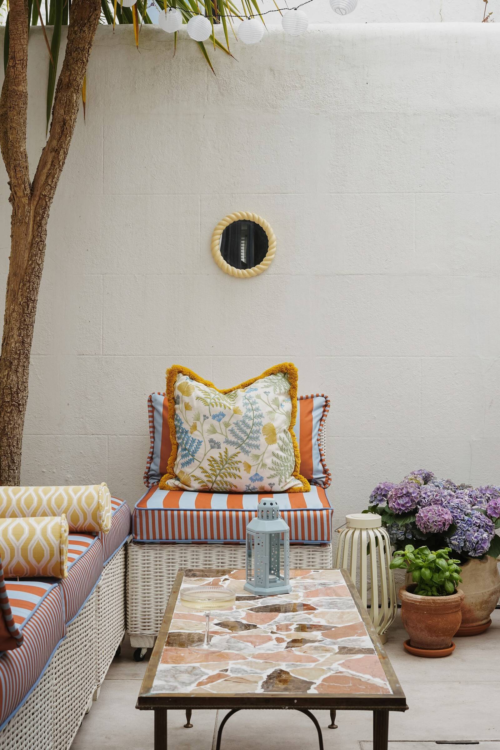 Bright, playful living room interior designed by Atelier Akuko in Brighton, featuring bold patterns and layered textures