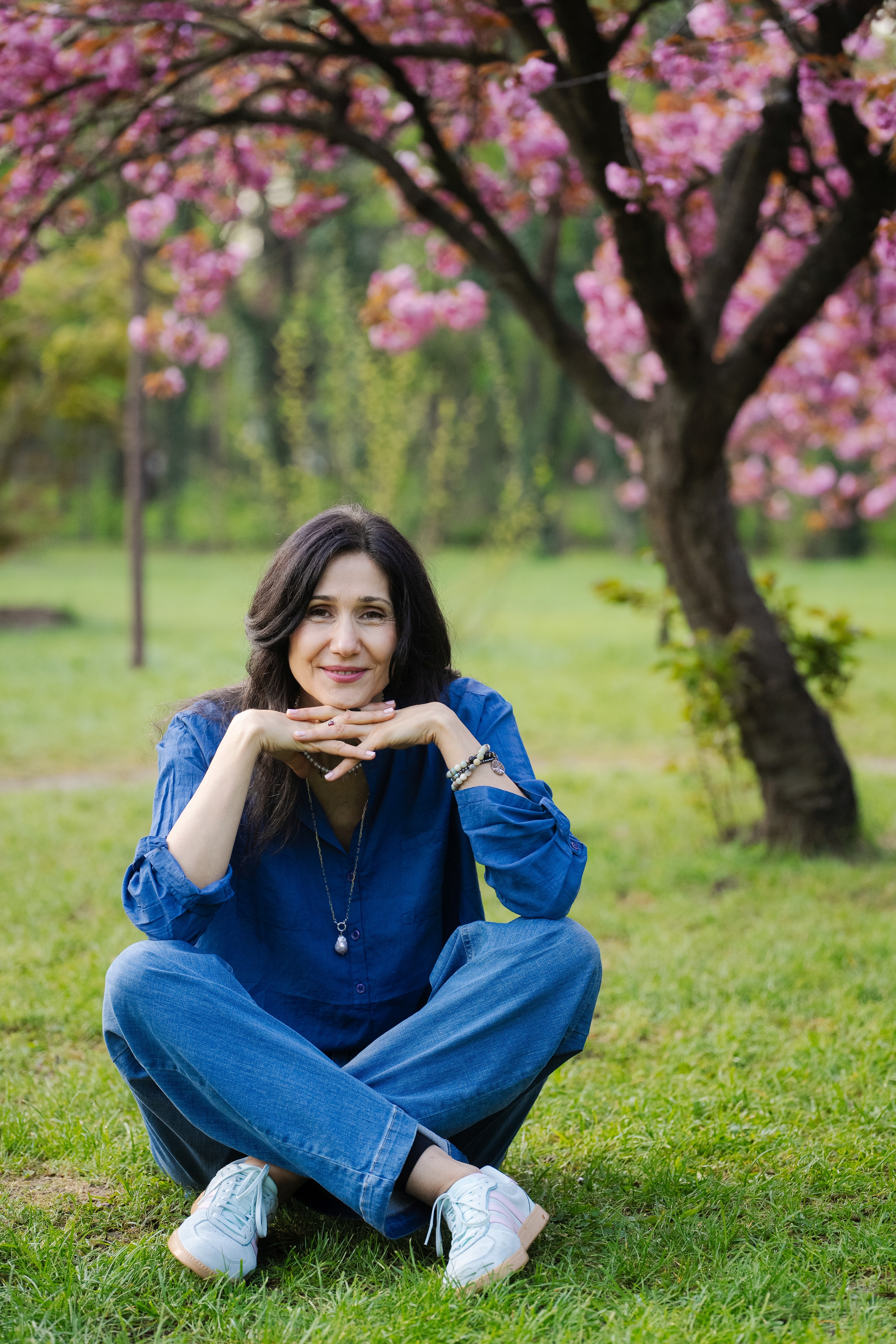 Person smiling at camera in nature