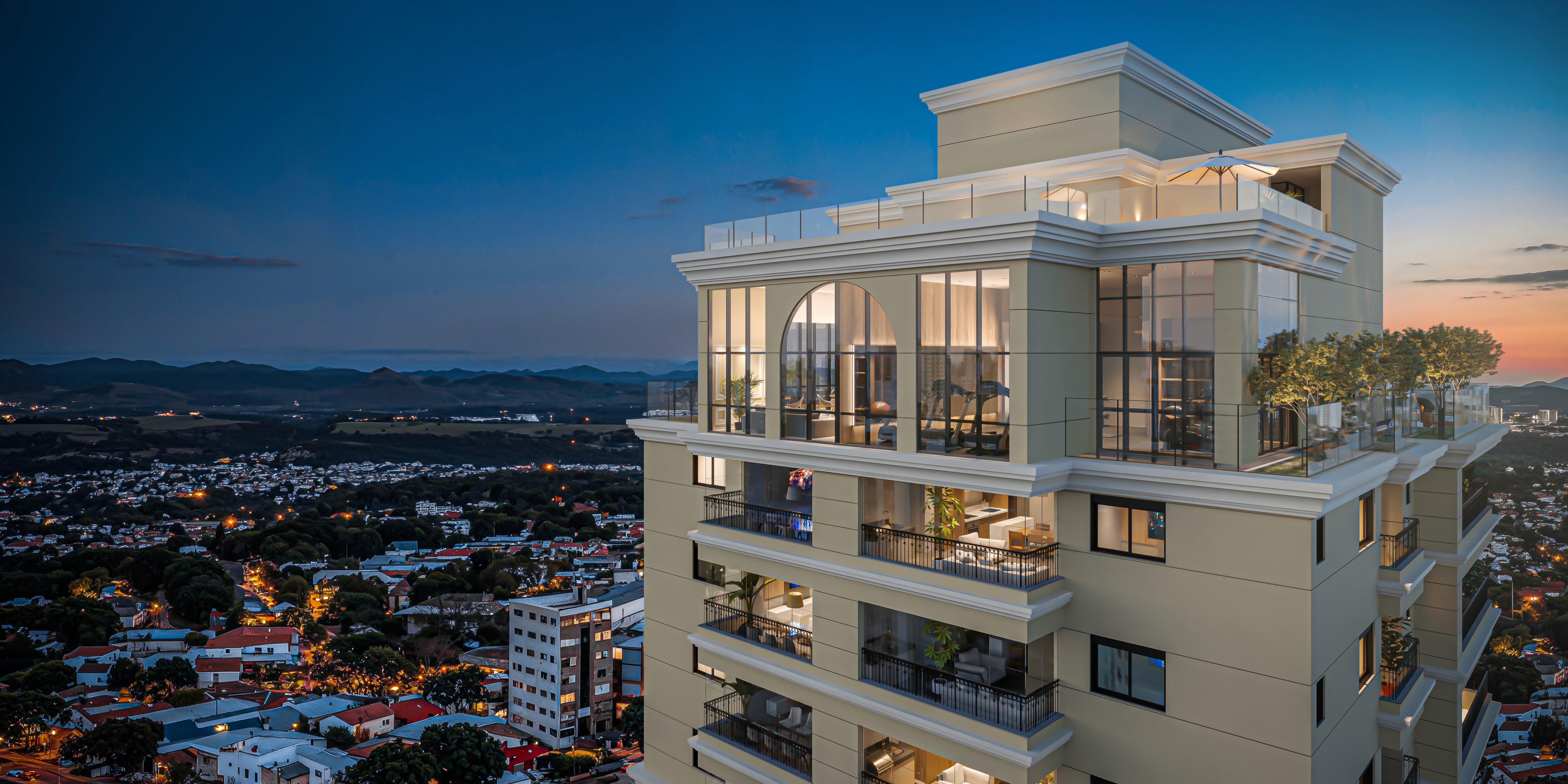 Curved modern skyscraper against a clear blue sky.