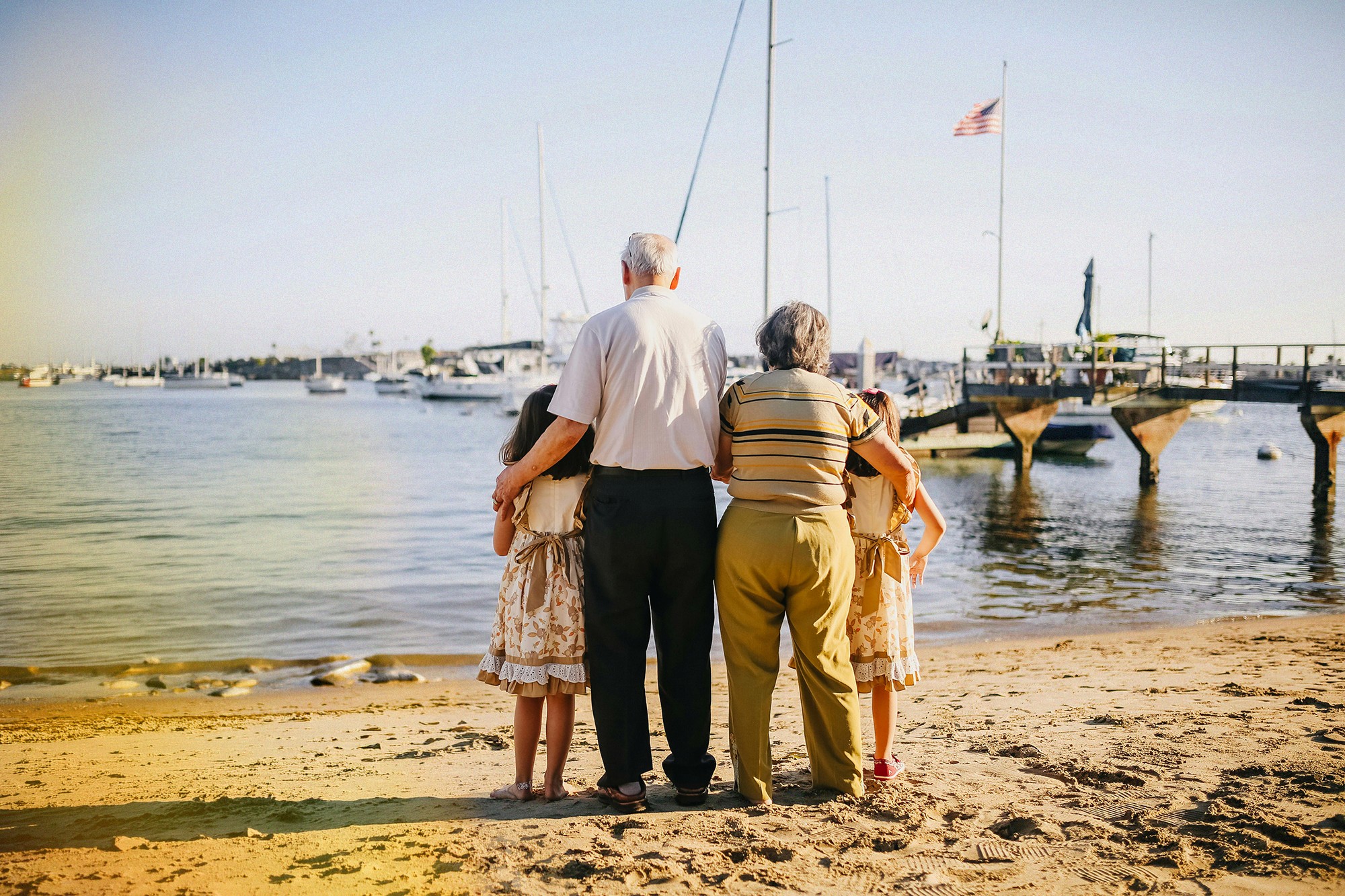 Family overlooking waterfront representing confidence and clarity when comparing private health insurance options