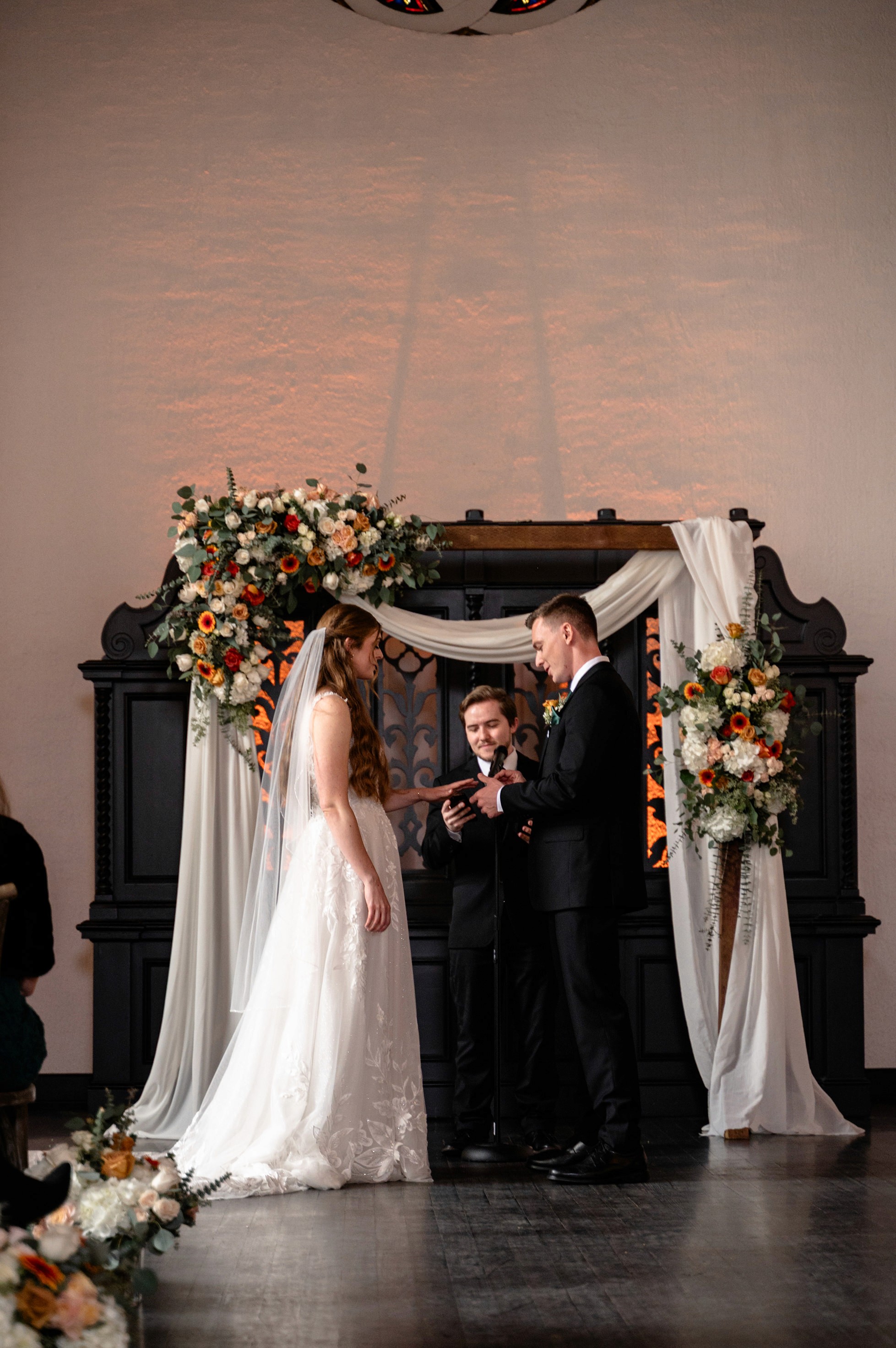 Flat lay wedding details with bouquet, rings, and sparkling bridal heels