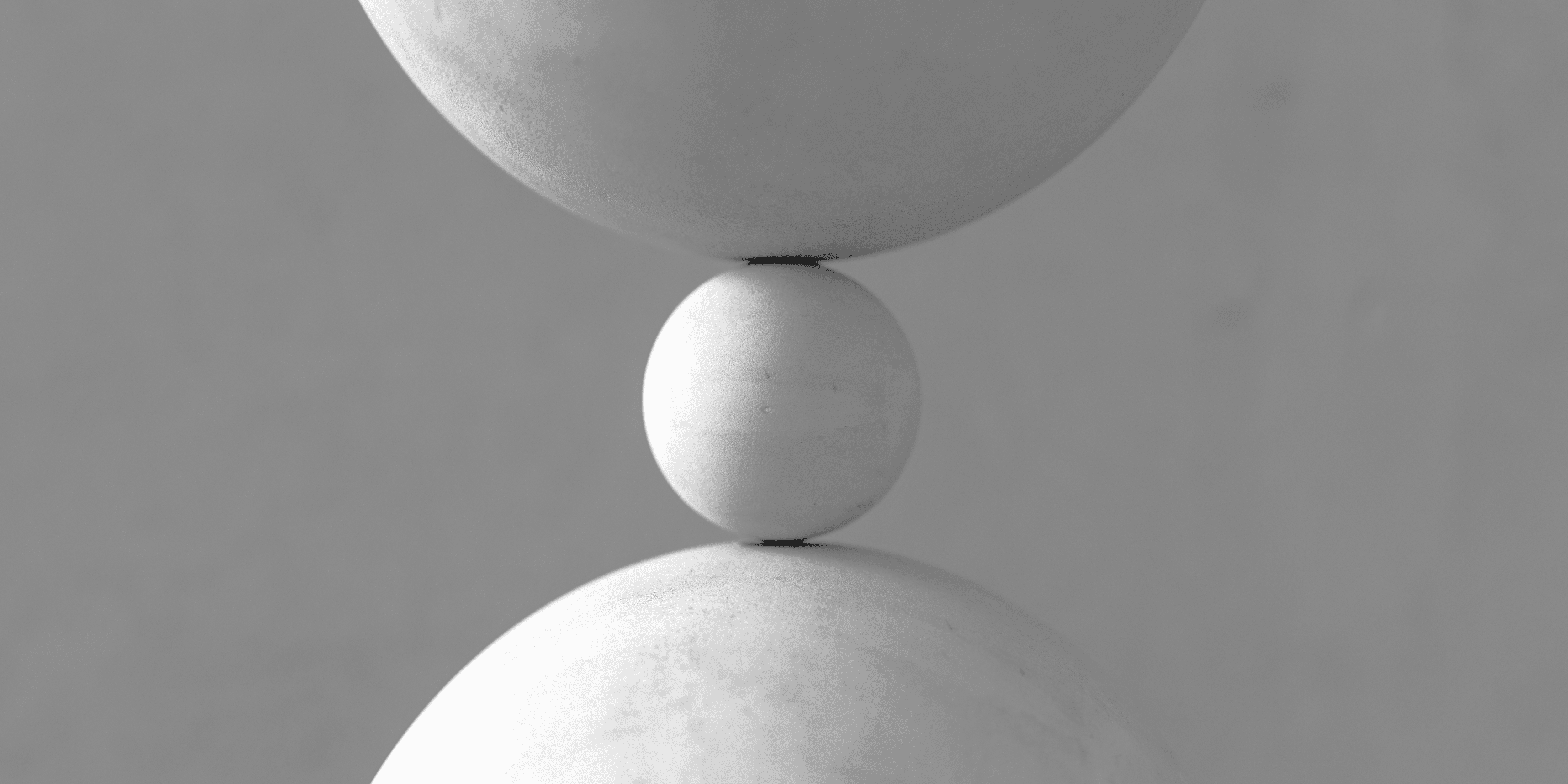 A close up of a sculpture of three balls