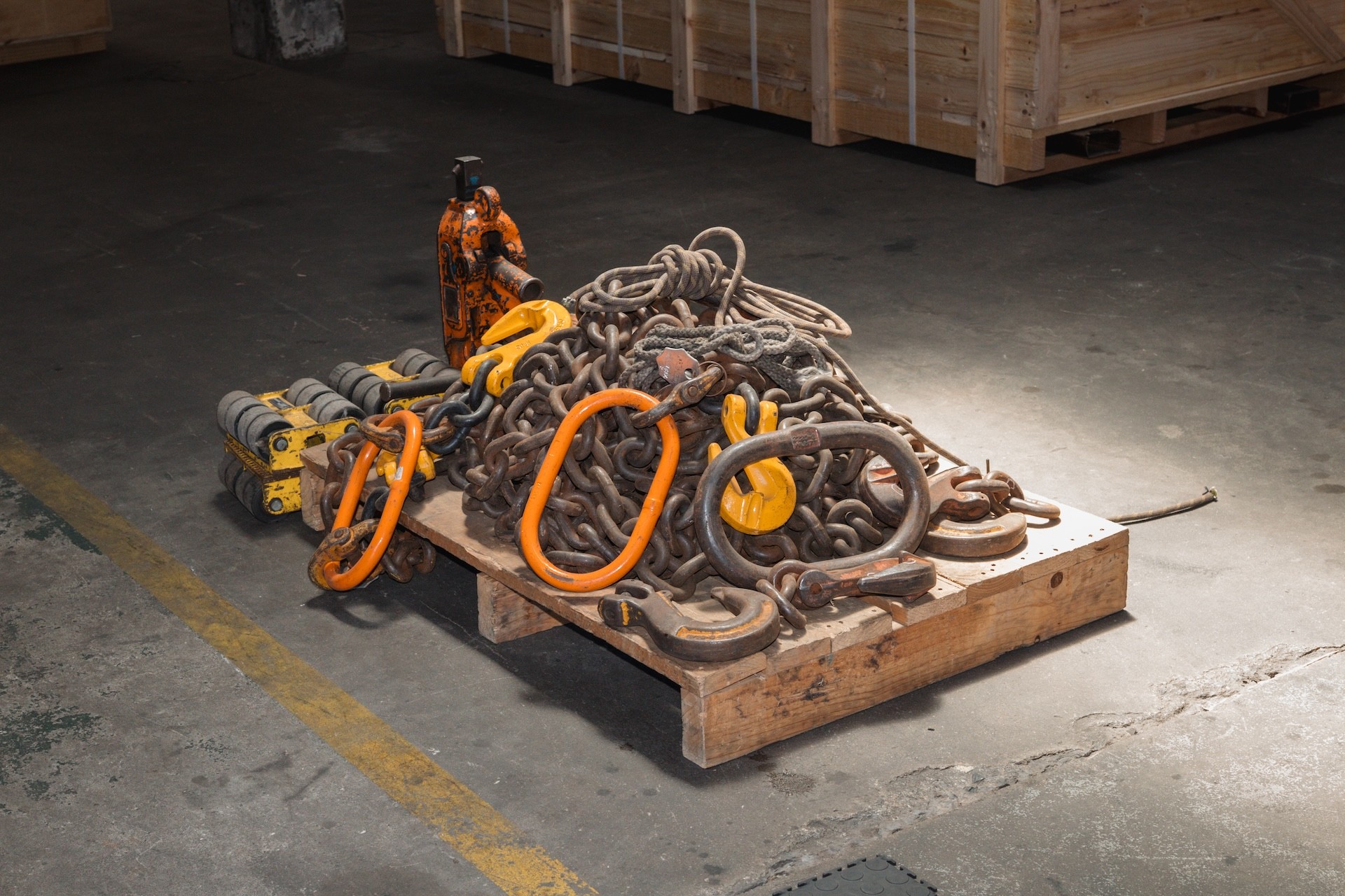 Truck with mounted crane performing a heavy lift rigging operation.