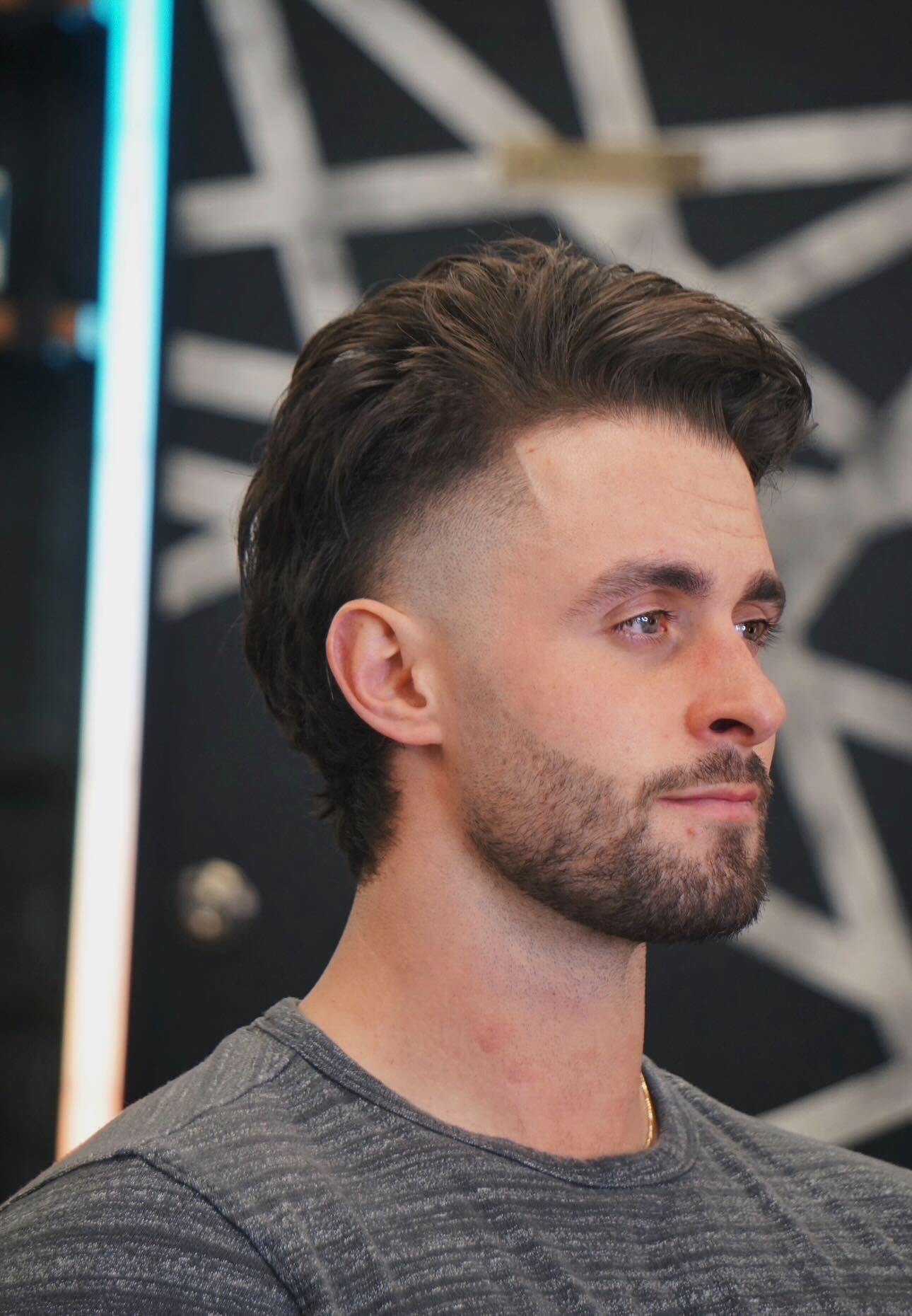 A person stands in a sandstone cave.