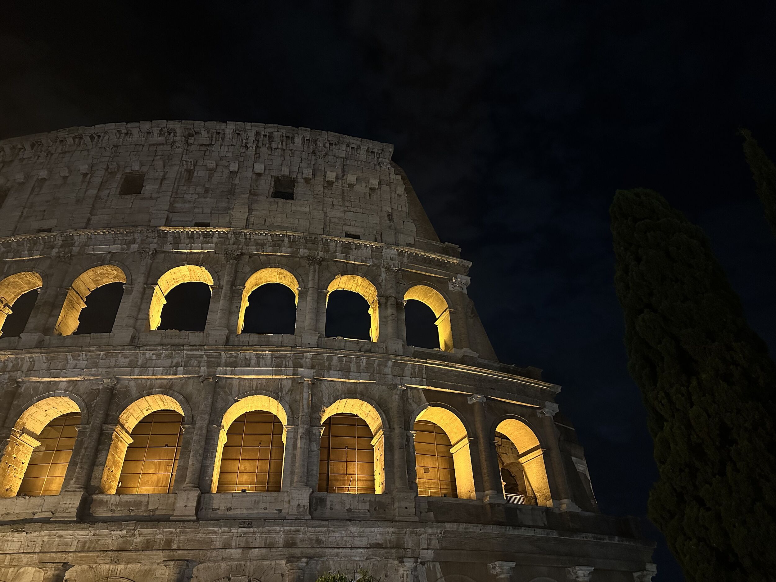 Colosseo illuminated at night from Via Sacra near Via di San Bonaventura, Rome