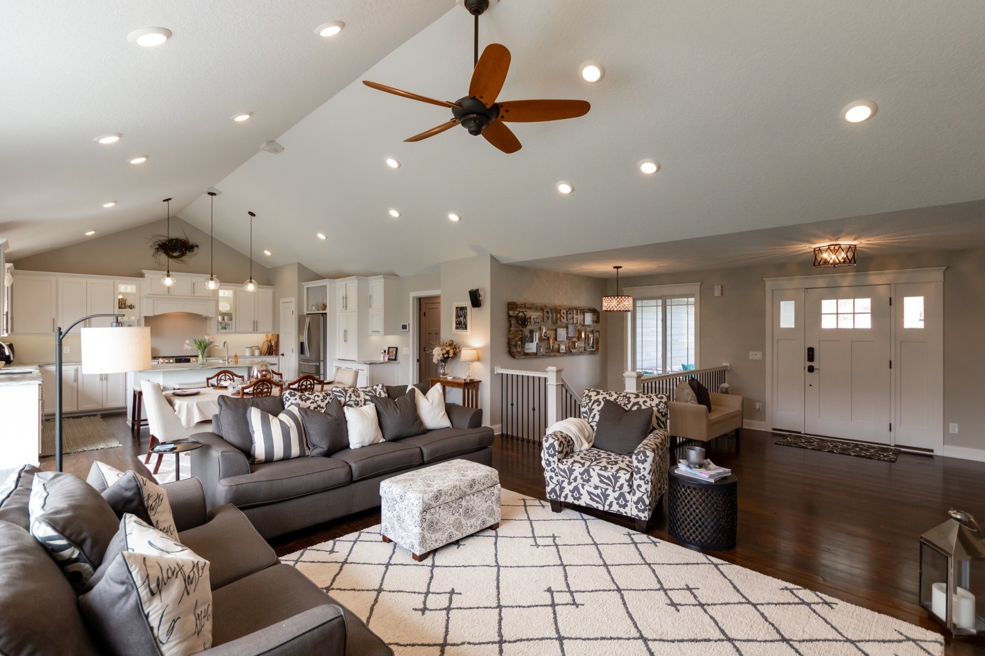 three men sitting on chair beside tables