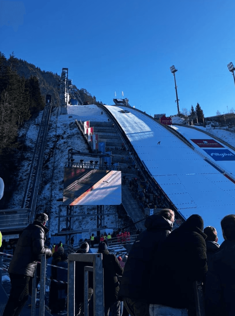 a person's hand reaching up into the air